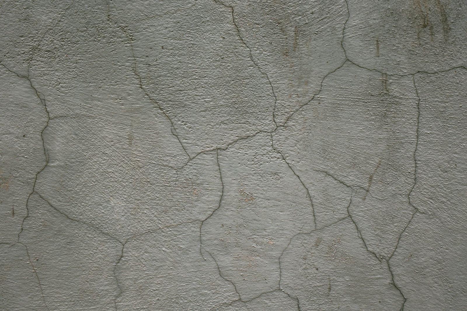 A crack running through a concrete exterior wall